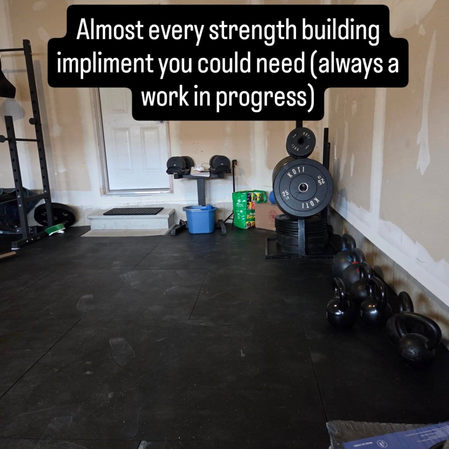 Rack of bumper plates and kettlebells at SWALLFitness Caledonia